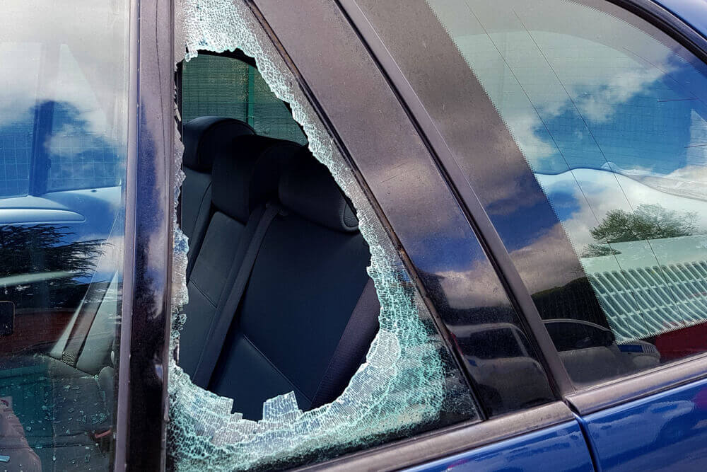side-window-car Broken side window on a car, example