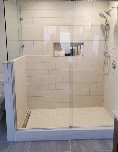 tile shower enclosed in glass